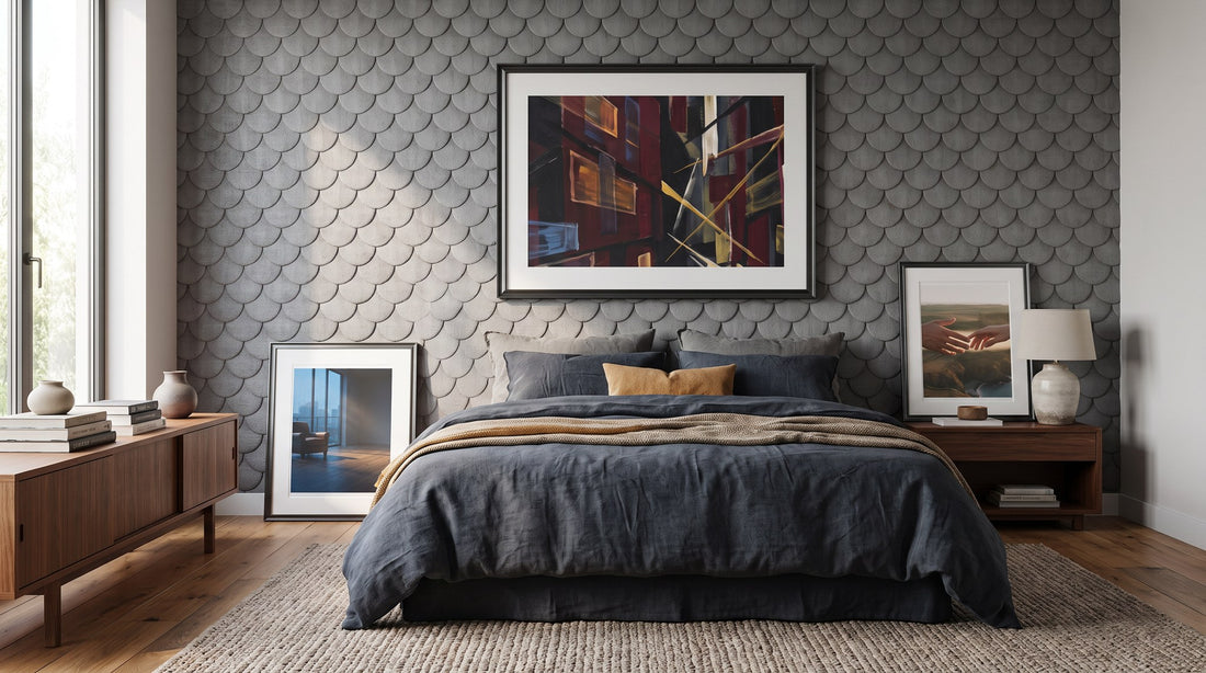 Bedroom with framed art prints above the bed