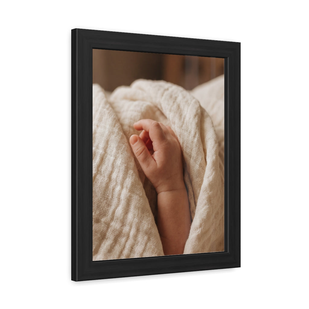 Framed Posters - Tender Newborn Hand in Soft Muslin Blanket...