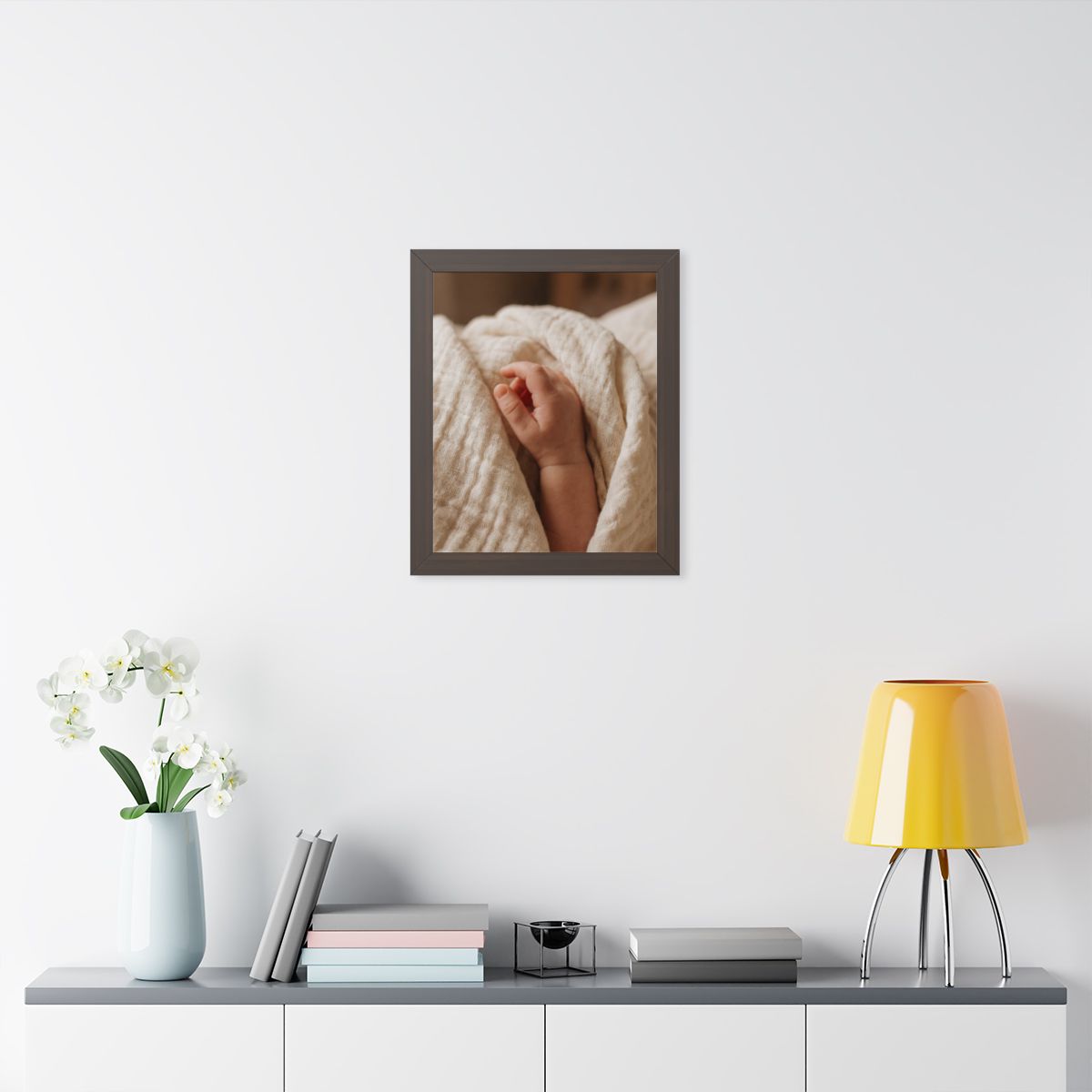 Framed Vertical Poster - Tender Newborn Hand in Soft Muslin...