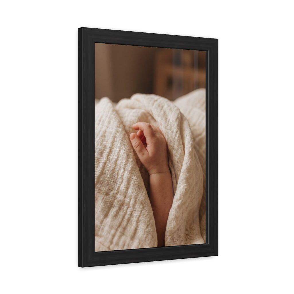 Framed Posters - Tender Newborn Hand in Soft Muslin Blanket...