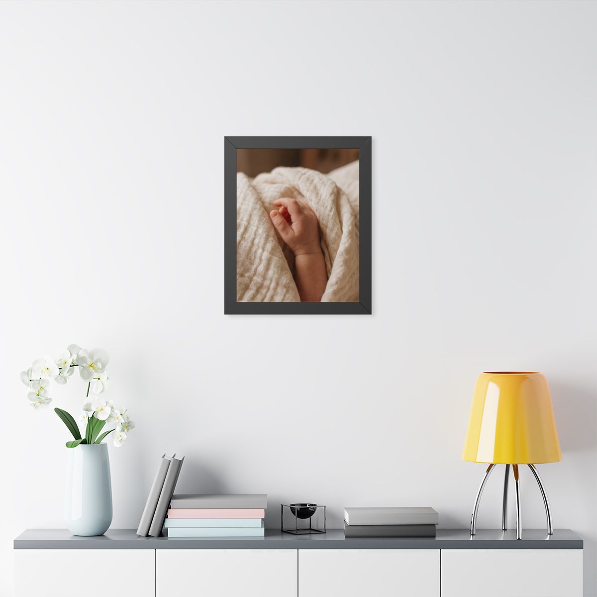 Framed Vertical Poster - Tender Newborn Hand in Soft Muslin...
