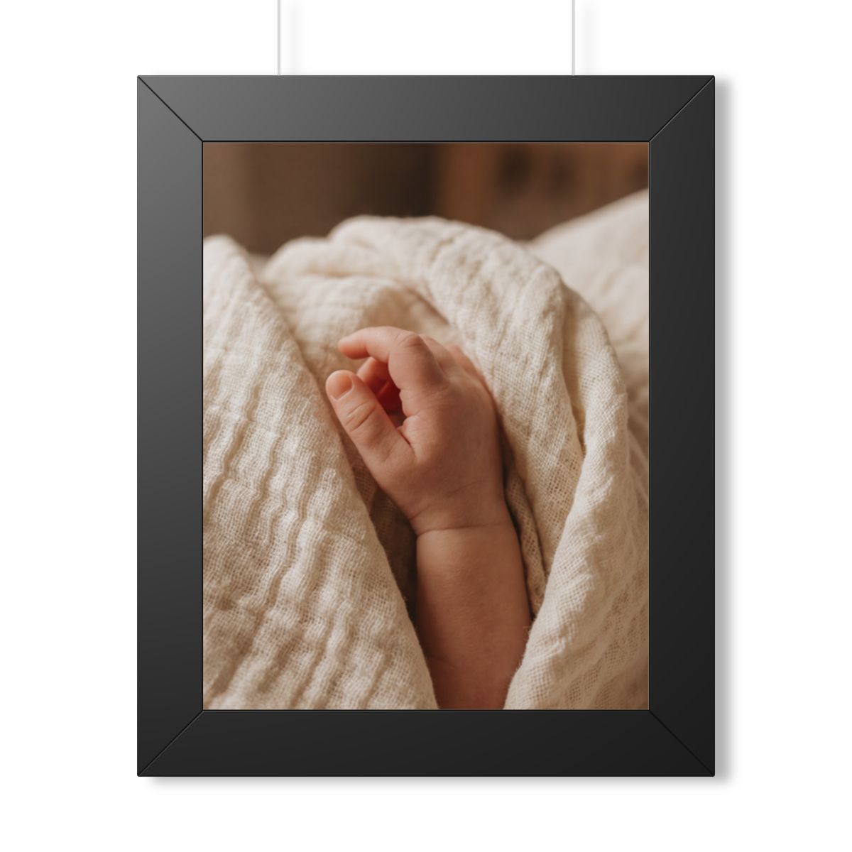 Framed Vertical Poster - Tender Newborn Hand in Soft Muslin...
