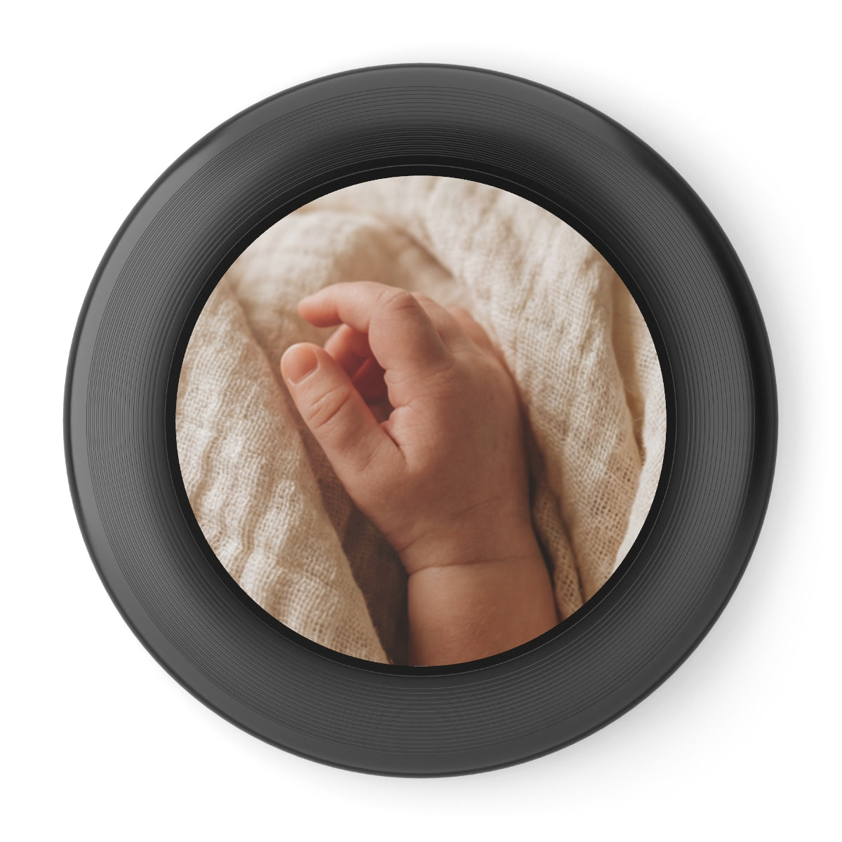Wham-O Frisbee - Tender Newborn Hand in Soft Muslin Blanket...